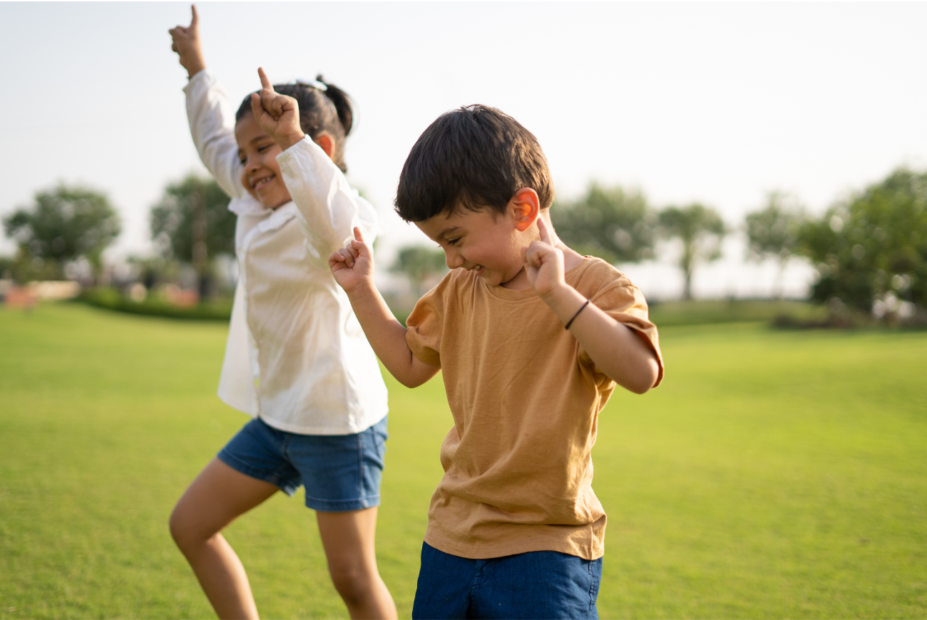 Two kids dancing together.