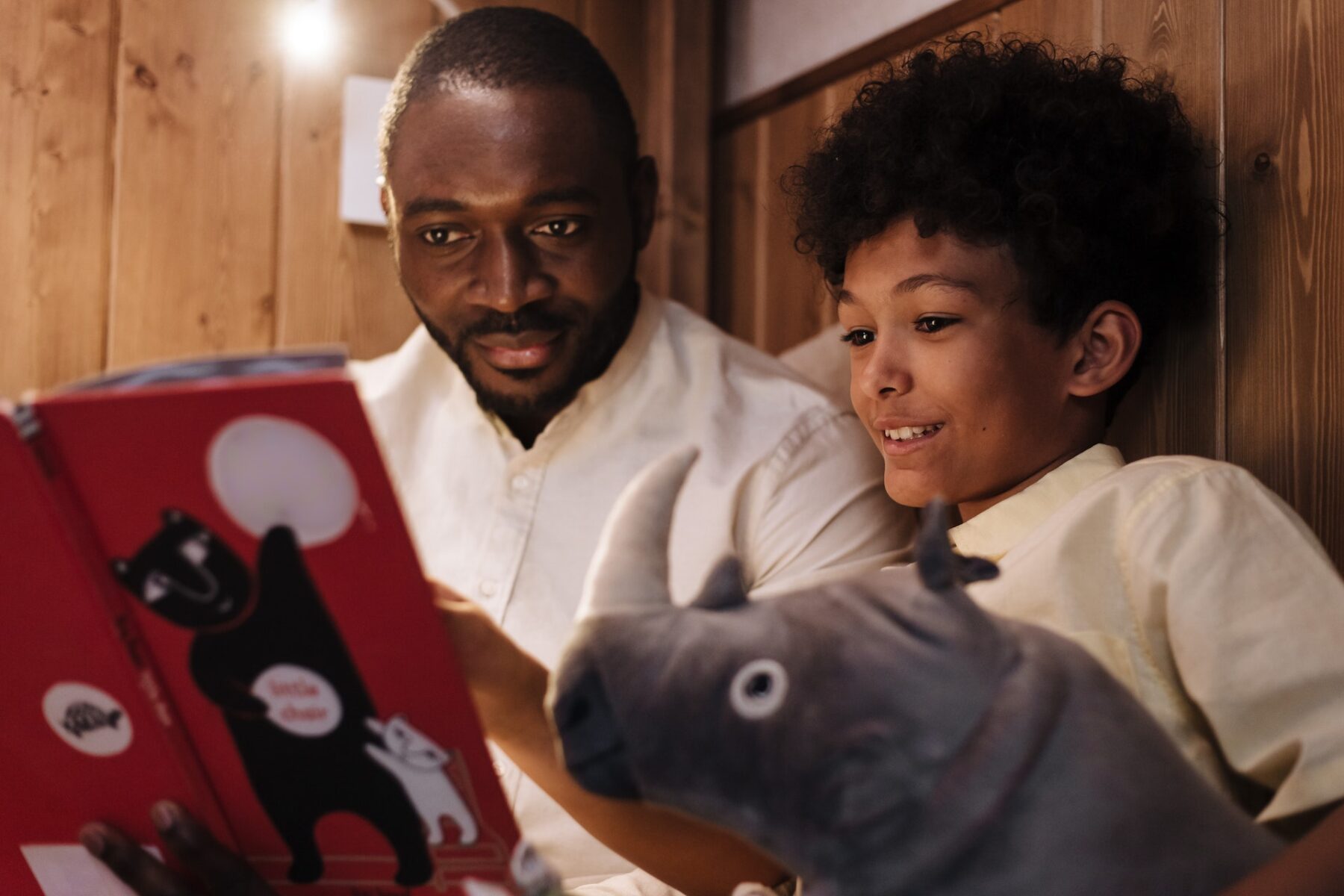 Father reading to son.