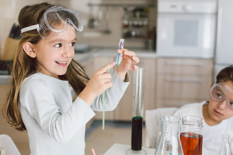 Kids playing with science experiment.