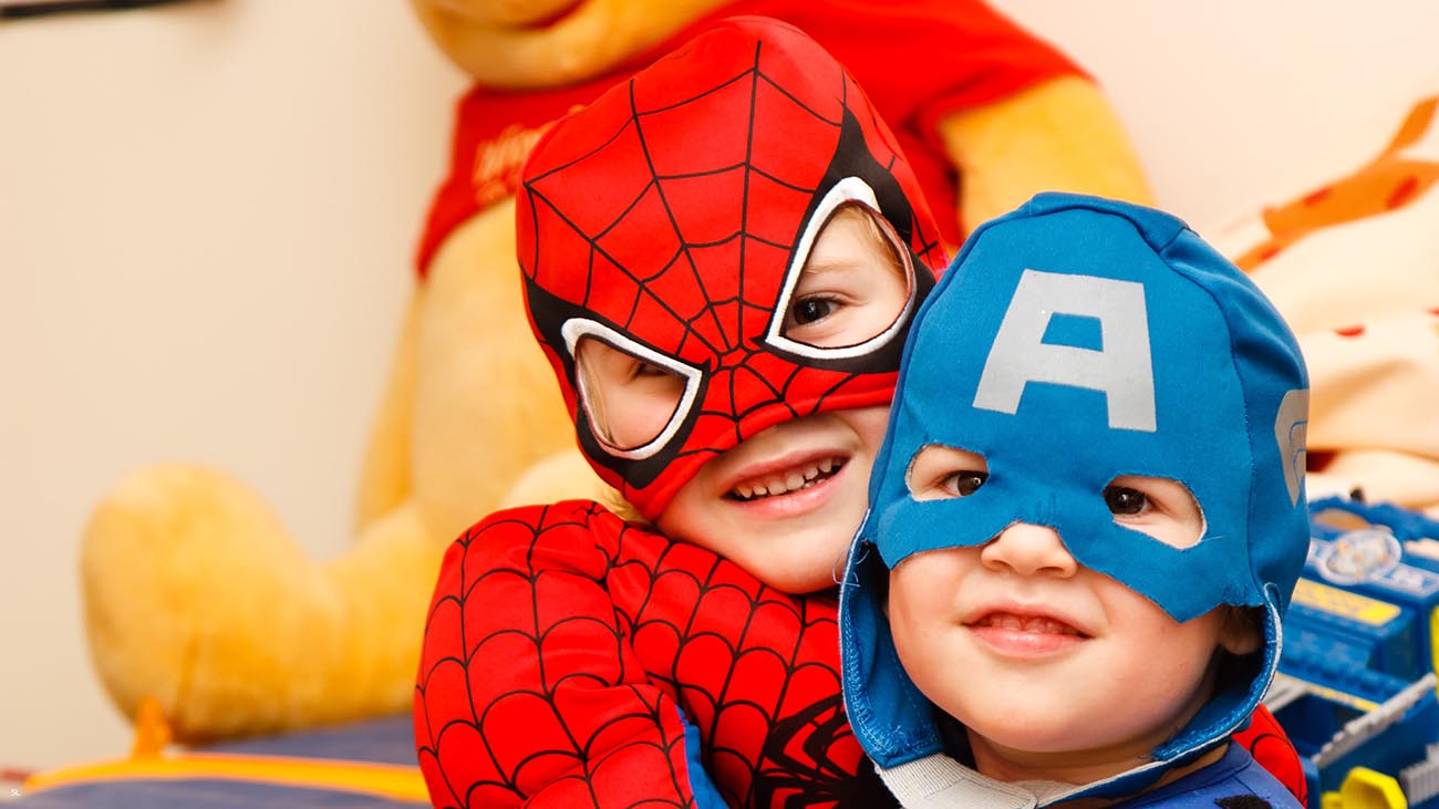 two children in superhero dress up outfits