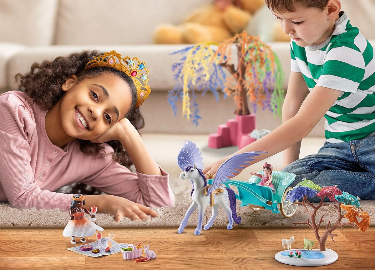 Kids playing with playmobil toys.