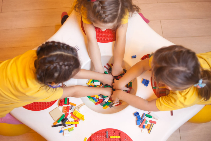 Children playing with lego parts.