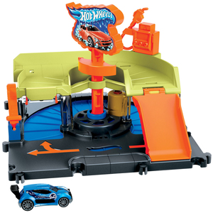 Chris plays with Hot Wheels cars and builds Hot Wheels City 